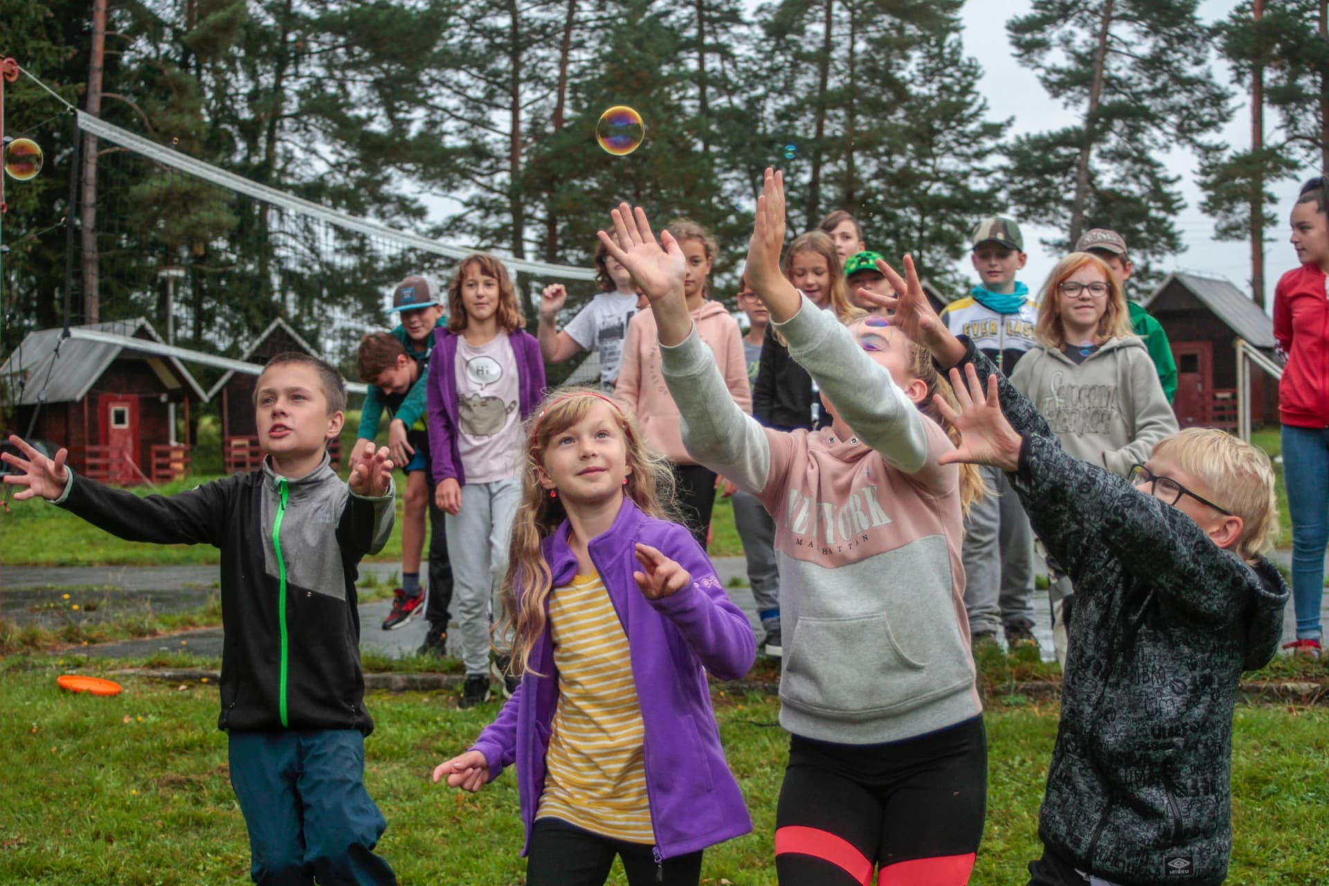 Kids catching bubbles